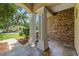 Charming front porch with stone accents and tiled flooring, framed by pillars at 2010 Se 25Th St, Ocala, FL 34471