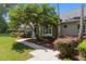 Landscaped front yard with a walkway leading to the main entrance of the residence at 2010 Se 25Th St, Ocala, FL 34471
