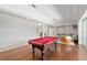 Large game room with a pool table, comfortable seating, and seamless access to other parts of the home at 2010 Se 25Th St, Ocala, FL 34471