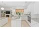 Beautiful kitchen with white cabinets, granite countertops, stainless appliances, kitchen island and open floor plan at 2010 Se 25Th St, Ocala, FL 34471