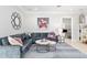 Cozy living room with sectional sofa, art, and access to the study/office at 2010 Se 25Th St, Ocala, FL 34471