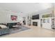 Spacious living room with fireplace, built-in shelving and large sectional sofa at 2010 Se 25Th St, Ocala, FL 34471