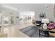 Open-concept living area showcasing a cozy seating arrangement and seamless flow to the kitchen at 2010 Se 25Th St, Ocala, FL 34471