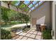 Charming outdoor patio area with a wooden pergola, offering shade and a relaxing space at 2010 Se 25Th St, Ocala, FL 34471
