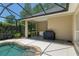 Outdoor kitchen area with grill and sink near the pool at 2010 Se 25Th St, Ocala, FL 34471