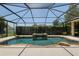 View of screened in pool and stone waterfall feature at 2010 Se 25Th St, Ocala, FL 34471