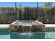 Stone waterfall feature in the screened in pool at 2010 Se 25Th St, Ocala, FL 34471