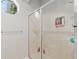 Modern bathroom shower with glass door and built-in shelving at 2010 Se 25Th St, Ocala, FL 34471