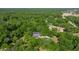 A luxurious home surrounded by a beautiful forest offers privacy and a tranquil setting at 20861 Sw 81St Loop, Dunnellon, FL 34431