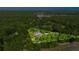 Aerial view of lushly landscaped private home site surrounded by mature trees and natural beauty at 20861 Sw 81St Loop, Dunnellon, FL 34431