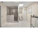 Bathroom with tile floor, glass enclosed shower, skylight, and modern fixtures at 20861 Sw 81St Loop, Dunnellon, FL 34431