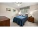 Cozy bedroom featuring a comfortable bed, ceiling fan, and bright natural light at 20861 Sw 81St Loop, Dunnellon, FL 34431