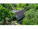 Aerial view of a two-story home with dual balconies and a screened-in pool area at 20861 Sw 81St Loop, Dunnellon, FL 34431