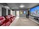 Movie theater with projector, big screen, reclining chairs, and dark walls at 20861 Sw 81St Loop, Dunnellon, FL 34431