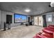 Home theater room featuring reclining seats, large screen, projector, and a neutral carpet at 20861 Sw 81St Loop, Dunnellon, FL 34431