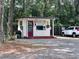 A secure security office is shown next to a white SUV at 20861 Sw 81St Loop, Dunnellon, FL 34431