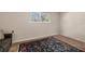 Sitting room featuring decorative rug, natural light, neutral walls and brown sofa at 20861 Sw 81St Loop, Dunnellon, FL 34431
