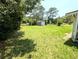 Spacious backyard with a shed, offering plenty of space for outdoor activities at 21298 Sw Peach Blossom St, Dunnellon, FL 34431