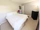 Comfortable bedroom with carpeting and natural light at 21298 Sw Peach Blossom St, Dunnellon, FL 34431