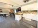 Well-lit kitchen with bar counter seating that opens to the living room and its comfortable seating at 21298 Sw Peach Blossom St, Dunnellon, FL 34431