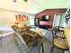 Comfortable living room with large sofa, accent chair, and a view towards the entry at 21298 Sw Peach Blossom St, Dunnellon, FL 34431