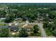 Aerial view of the neighborhood highlighting the home's location, tree cover, and residential street at 23 Larch Crse, Ocala, FL 34480