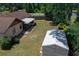 Backyard view with shed and lanai showcasing outdoor space and potential for relaxation or entertainment at 23 Larch Crse, Ocala, FL 34480