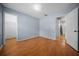 Bedroom features wood floors, adjacent bathroom and walk-in closet at 23 Larch Crse, Ocala, FL 34480