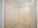 Walk-in closet features tile flooring and wire shelving for organized storage at 23 Larch Crse, Ocala, FL 34480
