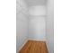 A walk-in closet with wire shelving and hardwood floors at 23 Larch Crse, Ocala, FL 34480