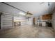 Functional garage space with ample storage shelves, a work bench, and a utility sink at 23 Larch Crse, Ocala, FL 34480