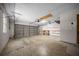 Spacious garage with concrete floors and plenty of room for parking and storage at 23 Larch Crse, Ocala, FL 34480