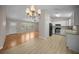Bright, open floor plan featuring a kitchen with modern appliances and a spacious dining area at 23 Larch Crse, Ocala, FL 34480