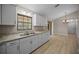 Well-equipped kitchen featuring stainless steel appliances, granite countertops, and ample cabinet space at 23 Larch Crse, Ocala, FL 34480