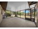 Relaxing screened porch offers an outdoor living space with views of the backyard at 23 Larch Crse, Ocala, FL 34480