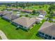 Aerial view of a spacious home with large windows and well-maintained landscaping near a golf course at 2478 Nw 53Rd Avenue Rd, Ocala, FL 34482