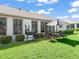 A cozy outdoor dining area and grill make this backyard perfect for entertaining and enjoying the weather at 2478 Nw 53Rd Avenue Rd, Ocala, FL 34482