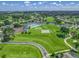 Aerial shot showcasing community amenities including a pool, tennis courts and impeccably landscaped grounds at 2478 Nw 53Rd Avenue Rd, Ocala, FL 34482