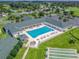 An aerial view of the community pool and recreation area surrounded by beautiful landscaping and amenities at 2478 Nw 53Rd Avenue Rd, Ocala, FL 34482