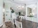 An open floor plan dining room with wood floors and decorative chandelier at 2478 Nw 53Rd Avenue Rd, Ocala, FL 34482