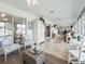 A Florida room with tiled floors and large windows with a view of the neighborhood at 2478 Nw 53Rd Avenue Rd, Ocala, FL 34482