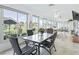 Bright Florida room with tile floors, golf course view, and dining table at 2478 Nw 53Rd Avenue Rd, Ocala, FL 34482