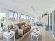 A relaxing Florida room with white walls and tiled flooring and views of the outdoors at 2478 Nw 53Rd Avenue Rd, Ocala, FL 34482