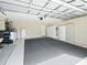 Spacious garage with organized storage, a grey carpet, and room for multiple vehicles at 2478 Nw 53Rd Avenue Rd, Ocala, FL 34482