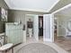 Hallway and closet with mint green and white accents and elegant wallpaper at 2478 Nw 53Rd Avenue Rd, Ocala, FL 34482