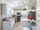A well lit kitchen, with white cabinets and stainless steel appliances at 2478 Nw 53Rd Avenue Rd, Ocala, FL 34482