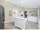Kitchen with stainless steel refrigerator, white cabinets, tile floors and butcher block island at 2478 Nw 53Rd Avenue Rd, Ocala, FL 34482