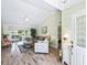 Inviting living room featuring hardwood floors, vaulted ceilings, comfortable seating and chandelier lighting at 2478 Nw 53Rd Avenue Rd, Ocala, FL 34482