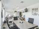 Well lit sunroom offers a view to a lounge area and a table with seating at 2478 Nw 53Rd Avenue Rd, Ocala, FL 34482