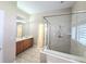 Bathroom with dual sinks, glass enclosed shower and tile flooring at 2515 Se 19Th Cir, Ocala, FL 34471